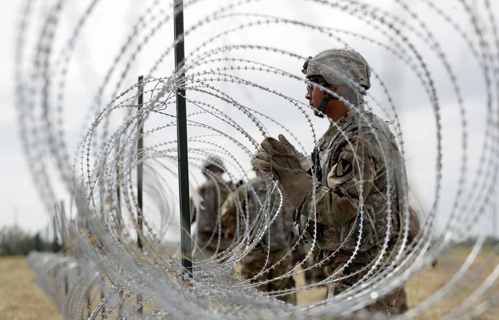 U.S. troops stand guard along the southern border with Mexico.