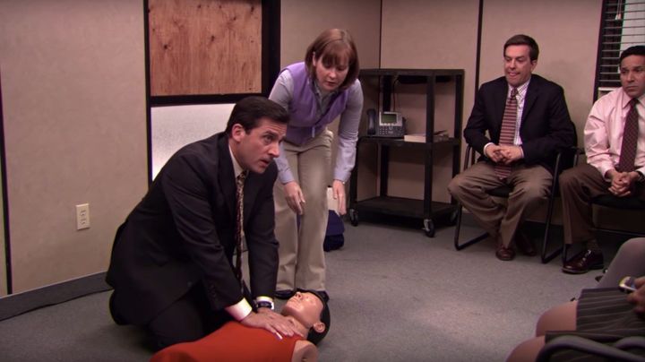 Michael Scott (Steve Carell) practices CPR on a dummy in a 2009 episode of “The Office.”