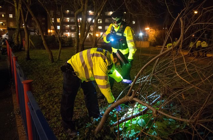 Officers search for weapons in the London borough of Lambeth on Wednesday night.