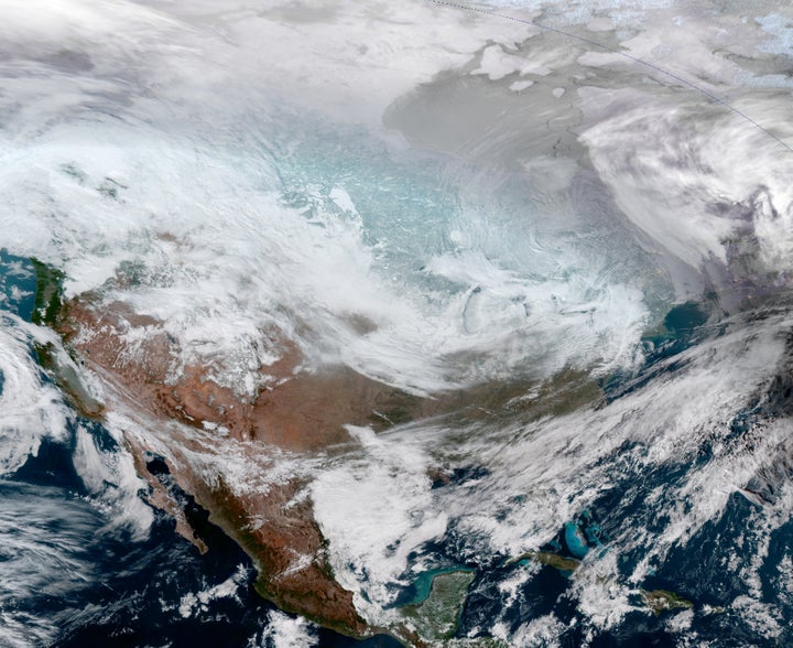 A satellite image of the continental United States shows the extreme cold weather phenomenon called the polar vortex over the