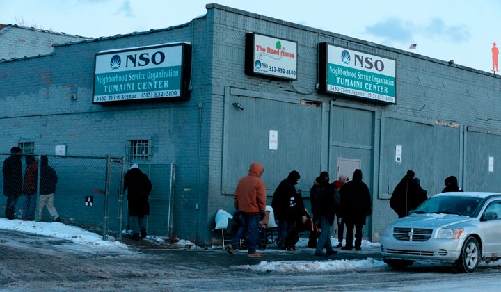 People gather in the cold weather outside of Neighborhood Service Organization on Third Ave. in Detroit, Michigan on Jan. 29,