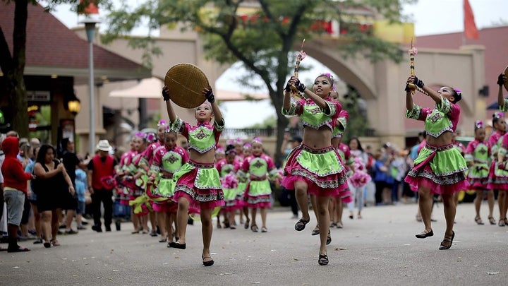 Dancers from a Hmong language and culture school perform at the 2018 Minnesota State Fair. Like other states, Minnesota is ta