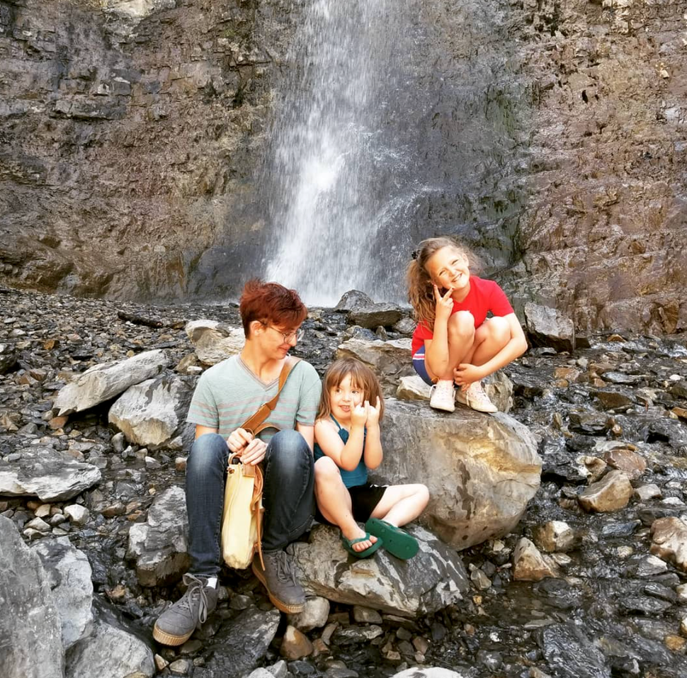 Winder with his two younger sisters after a hike during his senior year of college in 2018.