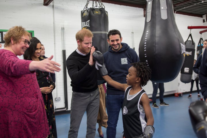 Meghan and Harry meet 7-year-old Aziah Selassie during their visit to Empire Fighting Chance.