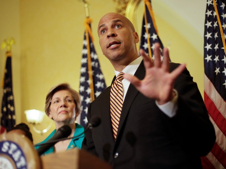 Sen. Cory Booker and Sen. Elizabeth Warren introduce the Dignity for Incarcerated Women Act at a news conference on Capitol Hill in Washington, July 11, 2017. 