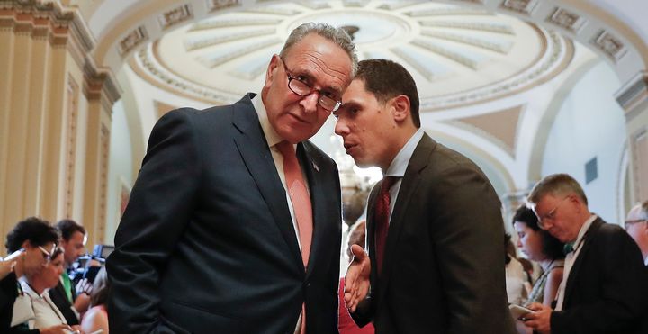 Senate Minority Leader Chuck Schumer (D-N.Y.), left, listens to his communications director, Matt House, before speaking to members of the media on Capitol Hill on July 11, 2017. House was forced out of his job in Schumer's office after allegations of sexual misconduct.