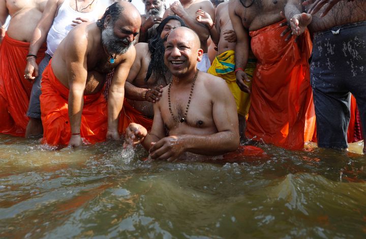 Yogi Adityanath and his ministers took a holy dip in the Ganga to wash off their sins, the cabinet minister and BJP ally said. 
