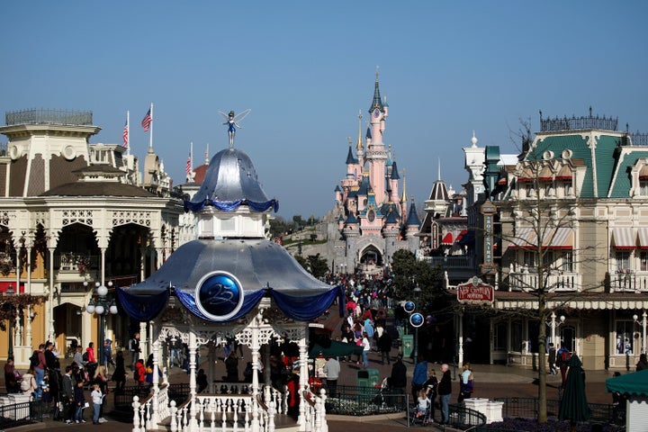 Visitors walk toward the Sleeping Beauty Castle in Disneyland Paris in 2017. The theme park will host its first official pride event this summer.