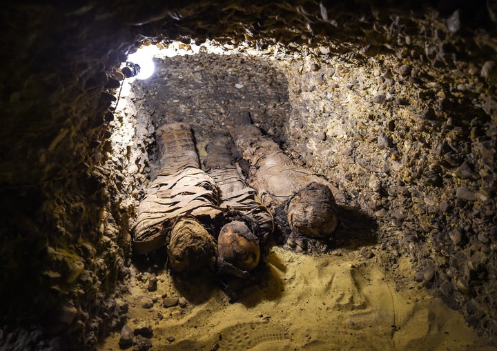 Newly discovered mummies wrapped in linen are seen in burial chambers dating to the Ptolemaic era at the necropolis of Tuna e
