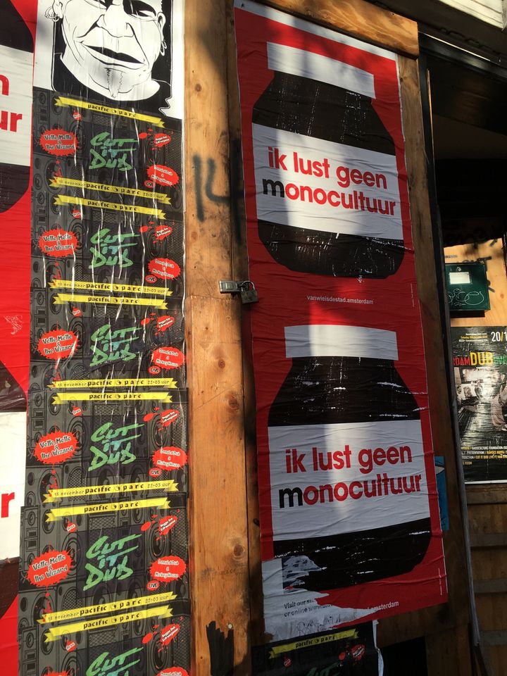 Posters in Amsterdam saying "I don’t want monoculture." Protestors have criticized the "commmercialization" of the city, which they blame on factors including tourism, Aribnb, gentrification and the sale of public housing stock.