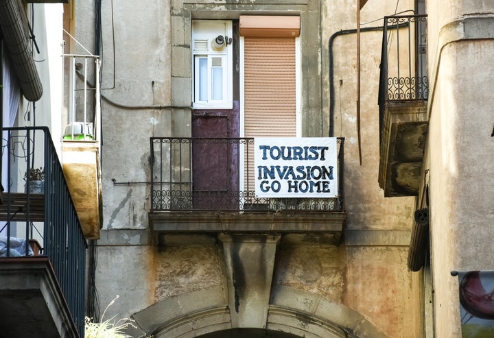 A banner in Barcelona, Spain. The city has seen protests over hyper-tourism. 