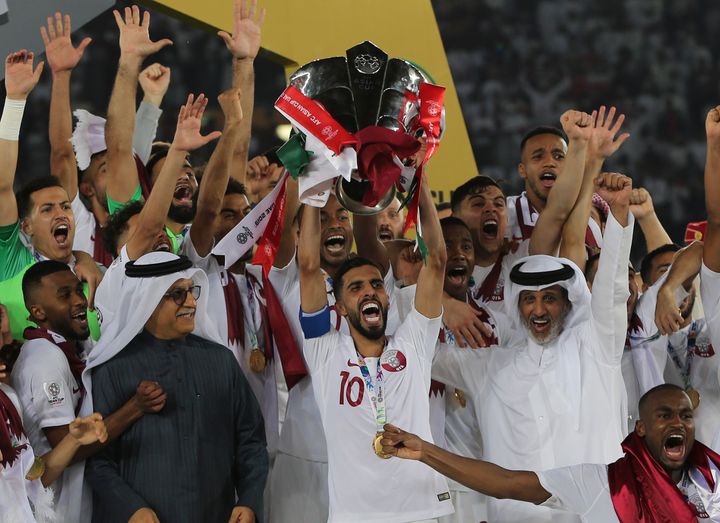 Qatar players lift the trophy after winning the AFC Asian Cup final match between Japan and Qatar in Abu Dhabi, UAE