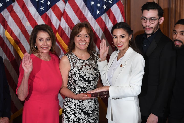 Speaker of the House Nancy Pelosi performs a ceremonial swearing-in for Rep. Alexandria Ocasio-Cortez (D-N.Y.), and her family at the start of the 116th U.S. Congress at the U.S. Capitol in Washington, D.C., Jan. 3, 2019.