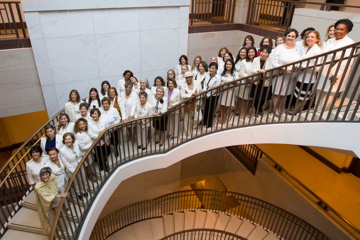 House Speaker Nancy Pelosi (center) is joined by other women wearing white in a group photo before the State of the Union address on Capitol Hill, Tuesday, Feb. 5, 2019 in Washington.