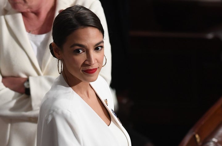Rep. Alexandria Ocasio-Cortez (D-N.Y.), the leading champion of a Green New Deal, arrives for the State of the Union address on Tuesday.