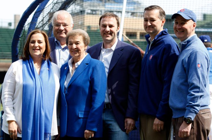 In this April 12, 2010 file photo, the Ricketts family poses before the Chicago Cubs baseball home opener against the Milwaukee Brewers in Chicago. From left are Cubs board member Laura Ricketts, Joe Ricketts, Marlene Ricketts, board member Todd Ricketts, board Chairman Tom Ricketts and board member Pete Ricketts. 