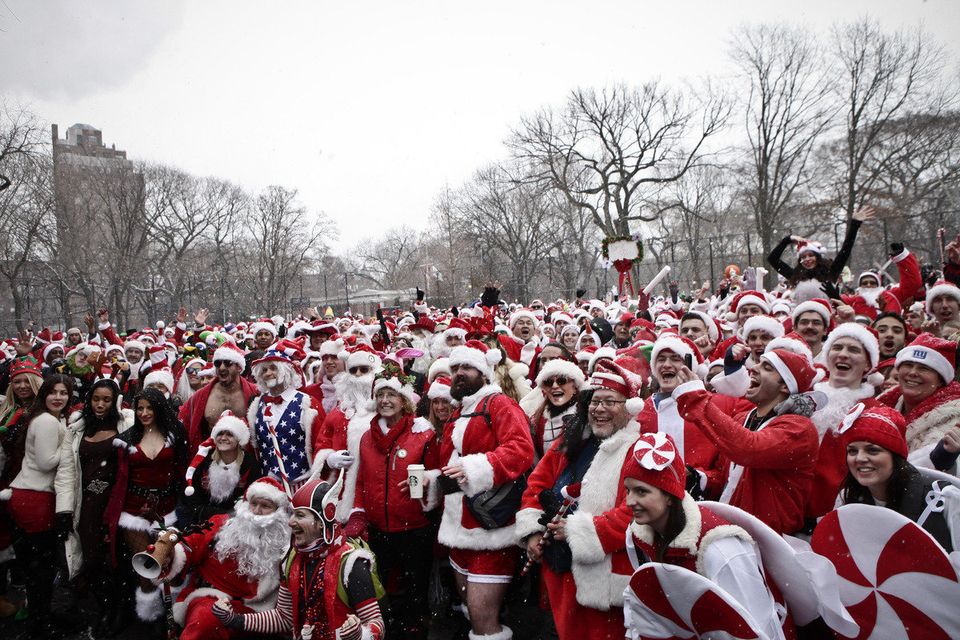 Revelers Dressed As Santa Take Part In Annual Bar Crawl Thru NYC