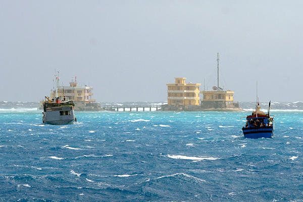 Vietnamese fishing boats are seen near Da Tay island in the Spratly archipelago in January, 2013