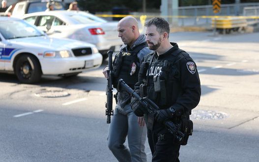 the aftermath of a shooting in Ottawa, where a soldier was shot at the War Memorial and shots were fired in Parliament.