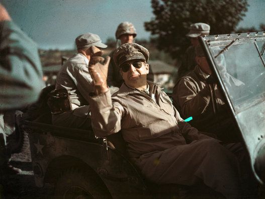 General Douglas MacArthur Riding in Jeep