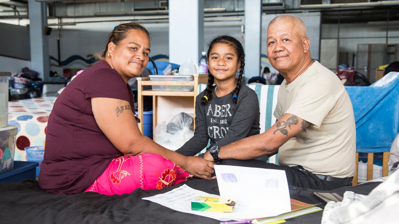 (From left to right) Ketnina Smith, Jennifer Biluk, and Jesse Biluk pose for a portrait at the Kaʻaʻahi Homeless Shelter for Women and Families in Honolulu, HI on Dec. 28, 2018.