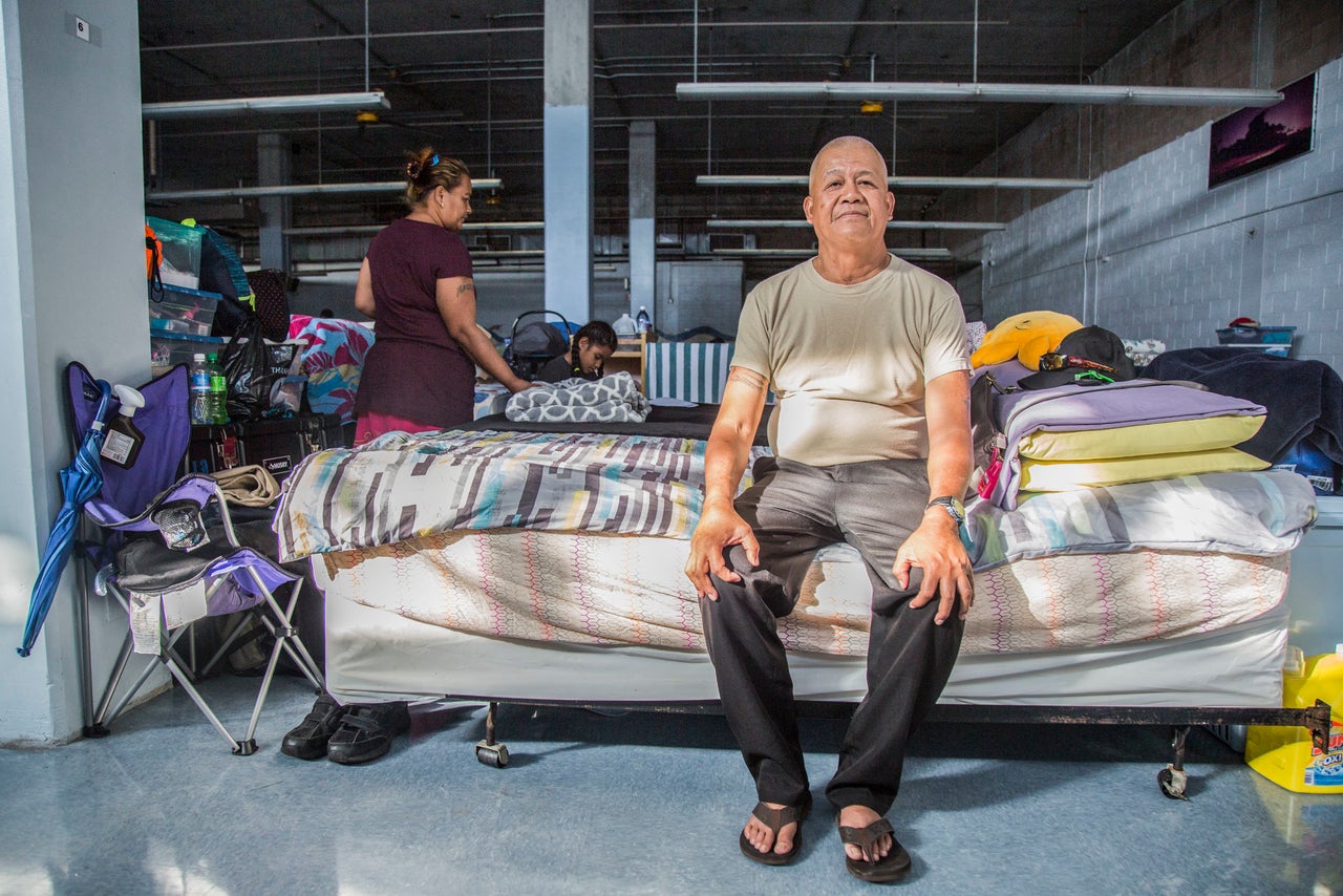 Jesse Biluk, a Micronesian migrant, poses for a portrait on his familyʻs bed at the Kaʻaʻahi Homeless Shelter for Women and Families in Honolulu, HI on Dec. 28, 2018.