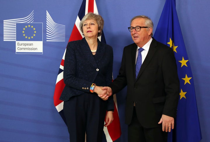 <strong>Theresa May in a frosty photo call with Jean-Claude Juncker</strong>