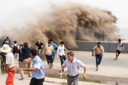 High Waves Of Qiantang River Tide Rush Onto Shore In Hangzhou