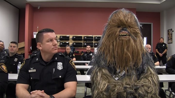 Fort Worth Police Officer Jimmy Pollozani gets ready to make the rounds with his rookie — make that Wookiee — partner of the day, Chewbacca (Sgt. Trey Gibbs), in a Star Wars-themed recruiting video that has drawn nearly 3 million views on social media.