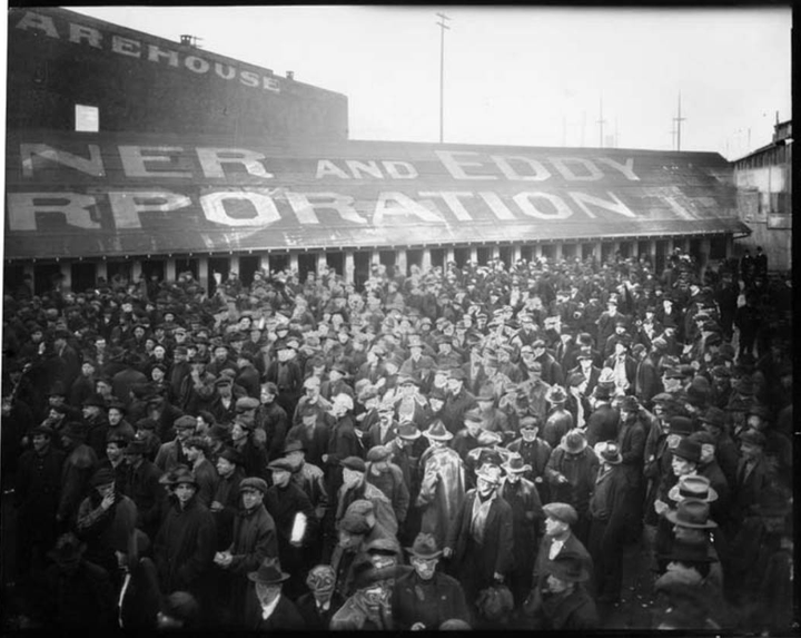 Seattle shipyard workers in 1919 as they walk off the job.