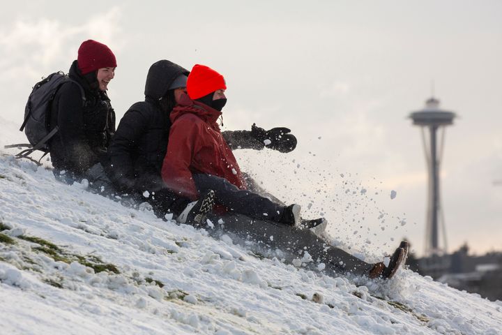 People sled at Gas Works Park after a large storm blanketed the city with snow on February 9, 2019 in Seattle, Washington.