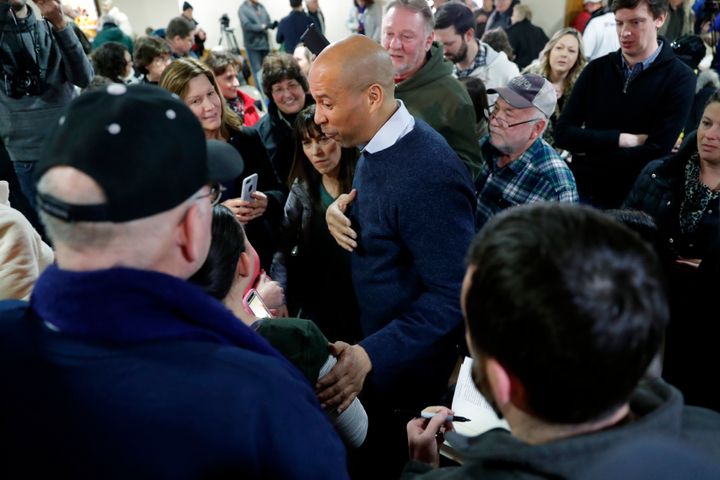 Booker minged with voters at the First Congregational United Church of Christ on Friday in Mason City, Iowa.