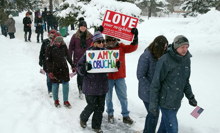Snow falls Sunday as rallygoers arrive at Boom Island Park in Minneapolis for Democratic Sen. Amy Klobuchar's announcement that she plans to run for president.