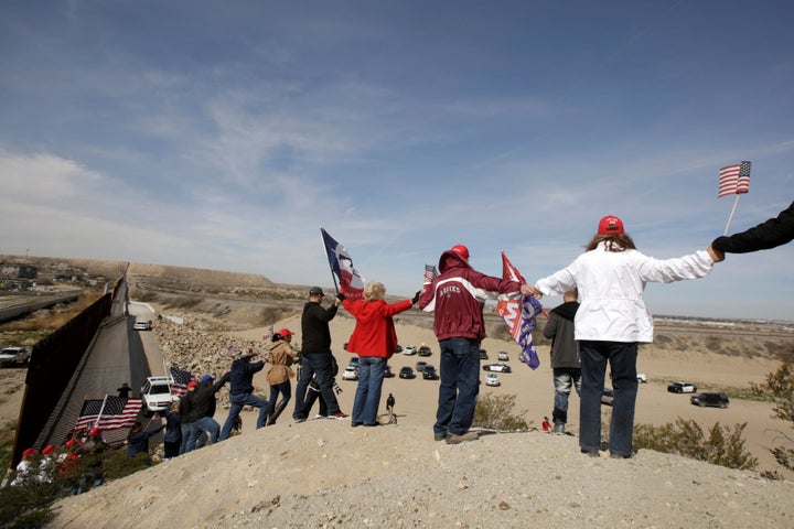   Protesters gathered near an unobstructed section of the US-Mexico border in Sunland Park, New Mexico. 