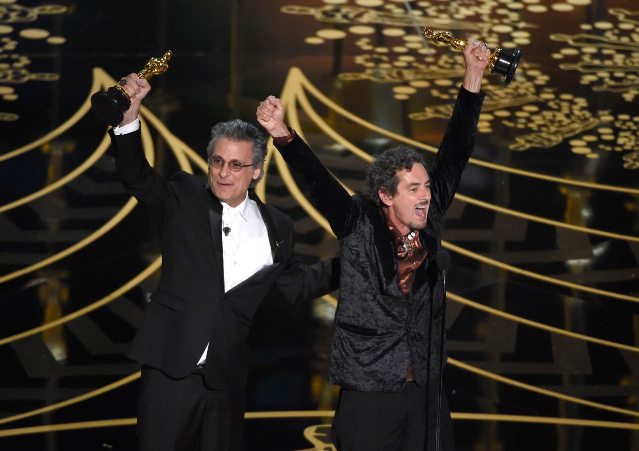 Mark Mangini and David White accept the Best Sound Editing Oscar for "Mad Max: Fury Road" in February 2016.