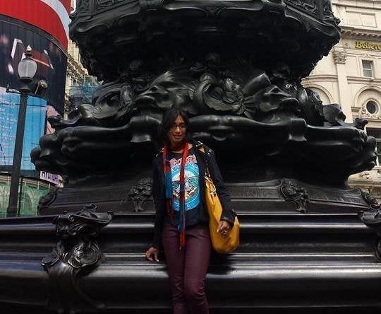 Anita Senaratna exploring London’s Piccadilly Circus on her own.