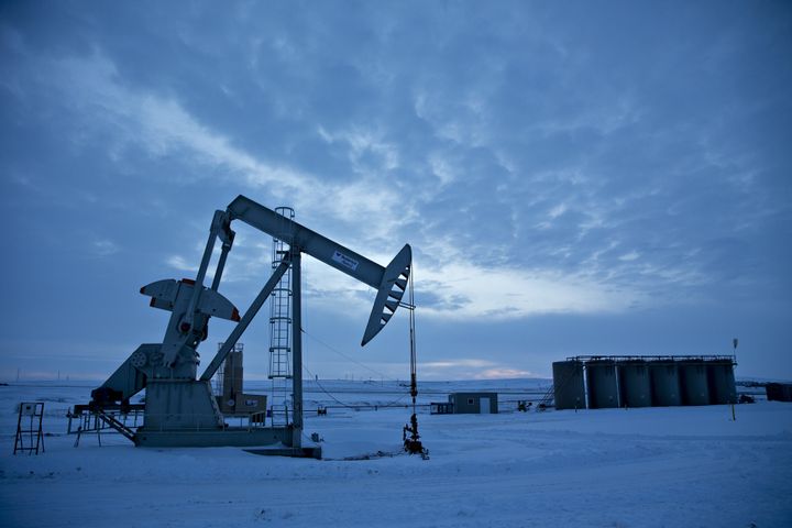 A pumpjack operates above an oil well in the Bakken Formation outside Williston, North Dakota, U.S., on Friday, March 9, 2018