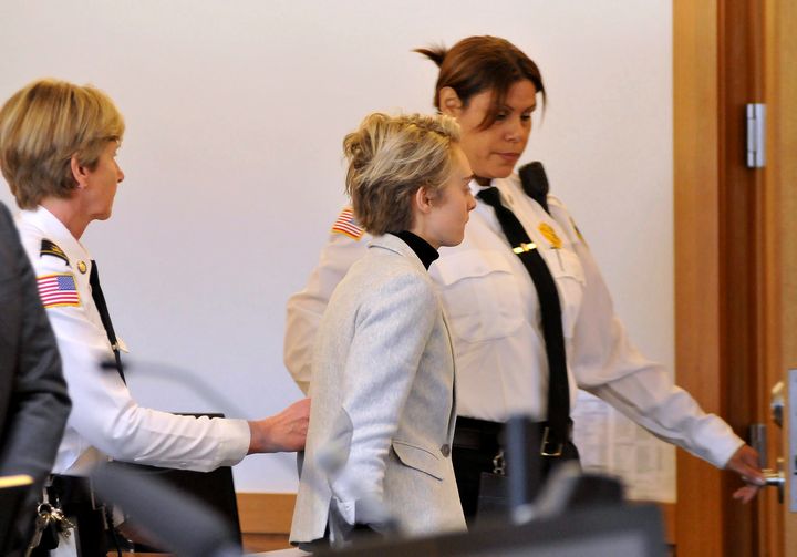 Michelle Carter, 22, center, is led away by court officers after a hearing on her prison sentence in Taunton District Court in Taunton, Mass. Monday, February 11, 2019. Carter was jailed Monday on an involuntary manslaughter conviction. 