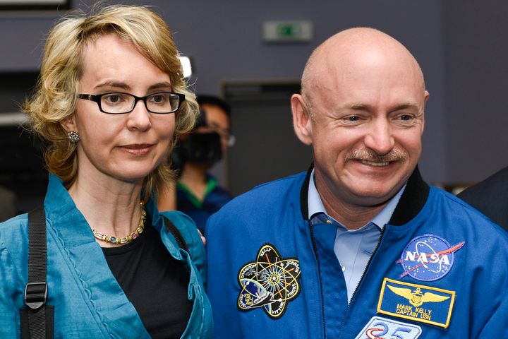 Former U.S. Congresswoman Gabrielle Giffords (L) and her husband Mark Kelly, NASA astronaut and commander of mission STS-134, pose for a picture at the European Organization for Nuclear Research (CERN) in Meyrin near Geneva in 2012.
