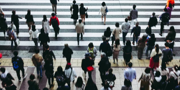 Asian People are across the crosswalk