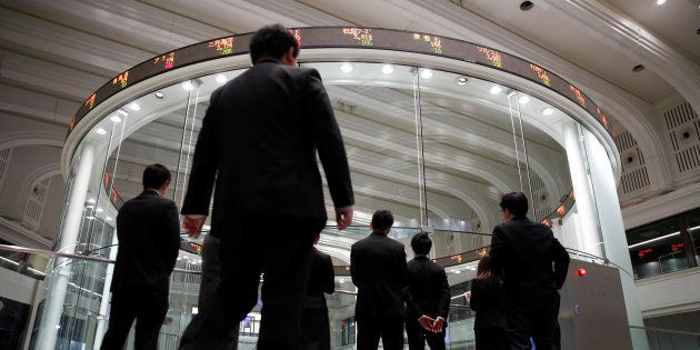 Visitors look at the Tokyo Stock Exchange (TSE) bourse in Tokyo, Japan, February 6, 2018. REUTERS/Toru Hanai
