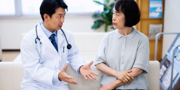 japanese doctor explaining senior patient
