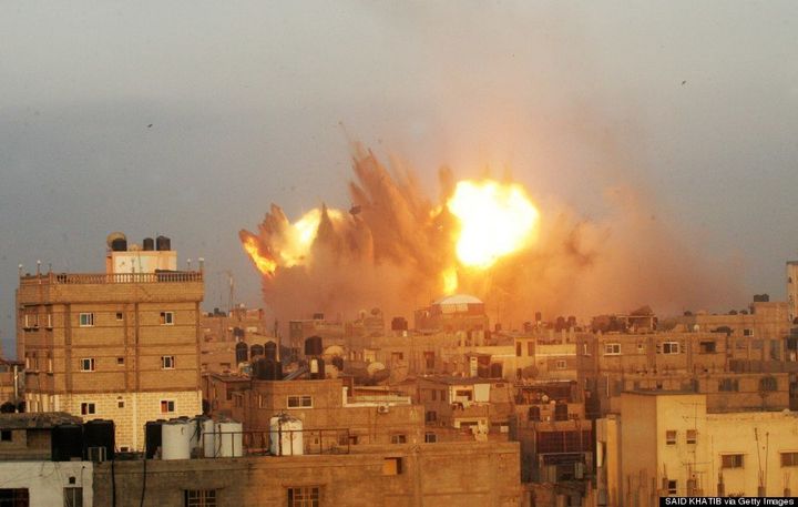 A ball of fire is seen following an early morning Israeli air strike on Rafah in the southern Gaza strip on July 11, 2014. (SAID KHATIB/AFP/Getty Images)