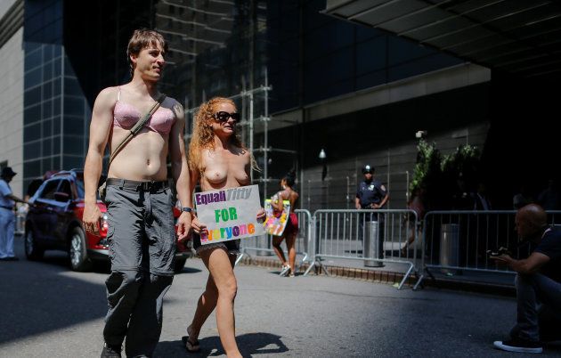 People take part in a march to celebrate the 10th anniversary of the International Go Topless Day at the Manhattan borough in New York, U.S., August 26, 2017. REUTERS/Eduardo Munoz TEMPLATE OUT