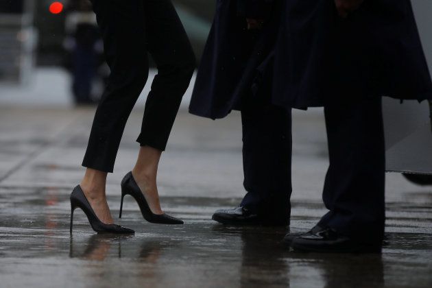 First lady Melania Trump's shoes are seen as she boards Air Force One with U.S. President Donald Trump (unseen) for travel to Texas to visit the areas devastated by Tropical Storm Harvey, the first major natural disaster of his White House tenure, from Joint Base Andrews, Maryland, U.S., August 29, 2017. REUTERS/Carlos Barria