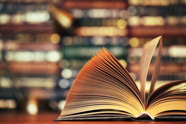 Disclosed book on a table. Close-up.