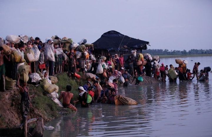 Rohingya refugees walk after crossing the Naf River at the Bangladesh-Myanmar border in Palong Khali, near Cox's Bazar, Bangladesh November 1, 2017