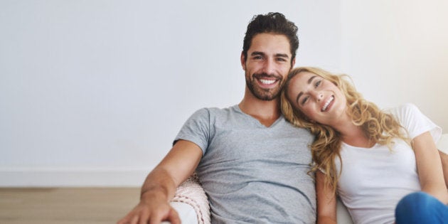 Shot of a young couple relaxing at home