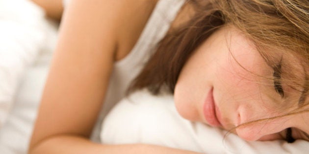 Young woman in bed, portrait