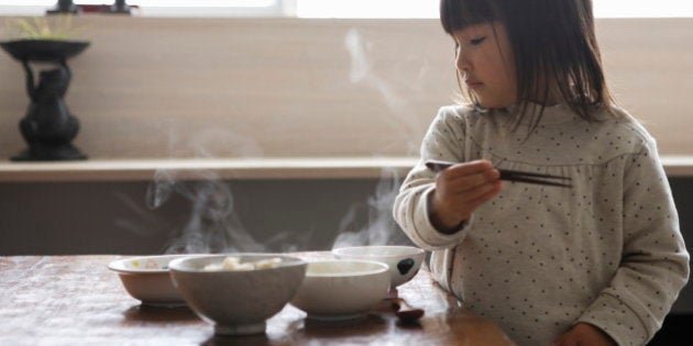 Little girl eating meal